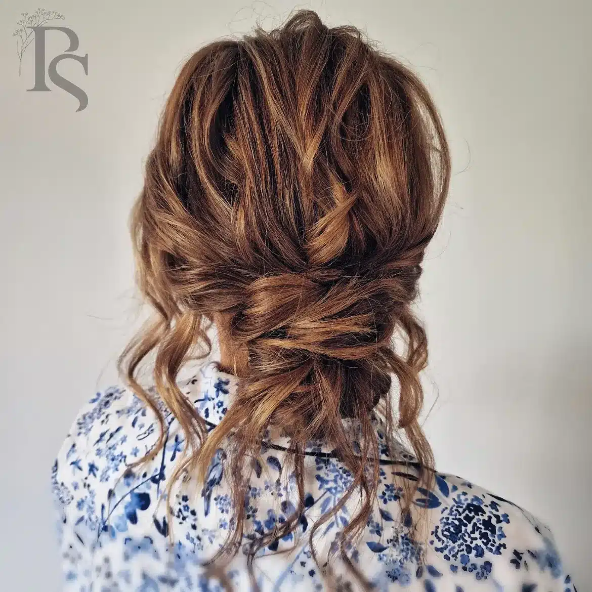 41. Messy Bun with Elegant Twists