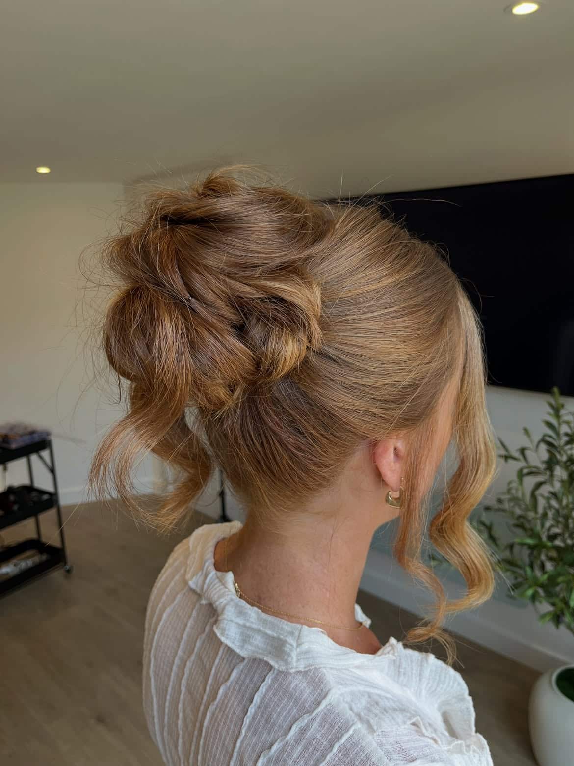 3. Tousled Updo Perfection